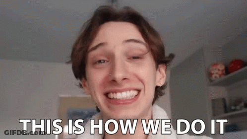 A Young Man Is Smiling With The Words `` This Is How We Do It '' Written On His Face . GIF