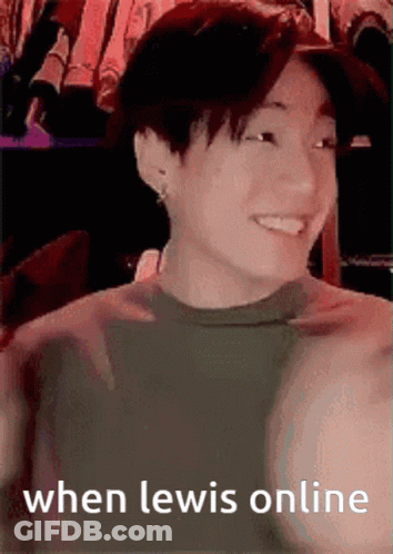 A Young Man Is Smiling With The Words When Lewis Online Written Below Him . GIF