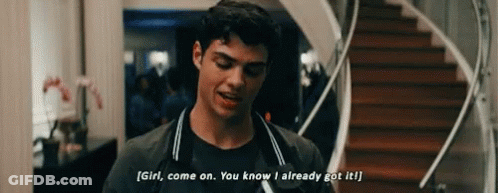 A Young Man Is Standing In Front Of A Staircase And Talking To A Girl . GIF