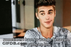 A Young Man Is Talking About His Pants Being Low . GIF