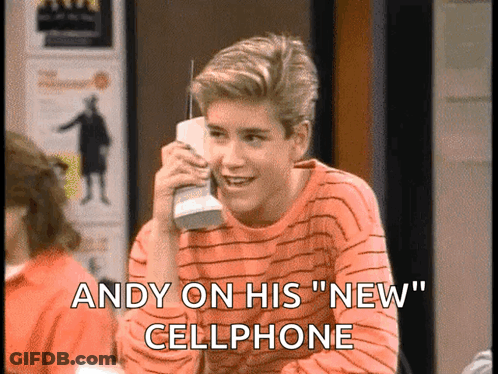 A Young Man Is Talking On A Cellphone With The Words Andy On His New Cellphone Below Him GIF