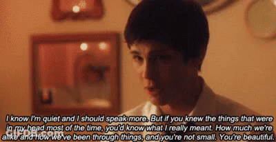 A Young Man Is Talking To Another Young Man In A Room With A Quote . GIF
