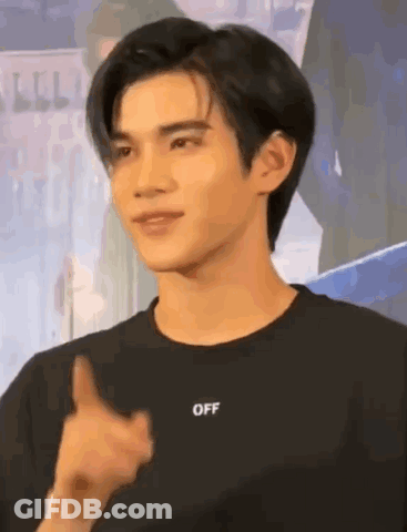 A Young Man Is Wearing A Black T-Shirt With The Word Off On It . GIF