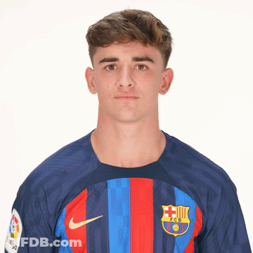 A Young Man Is Wearing A Blue And Red Nike Shirt GIF