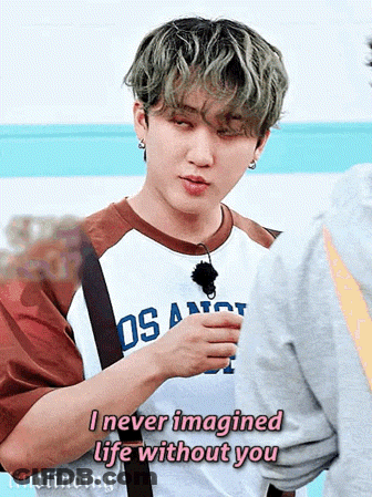 A Young Man Is Wearing A Los Angeles Shirt And Talking To Another Person . GIF