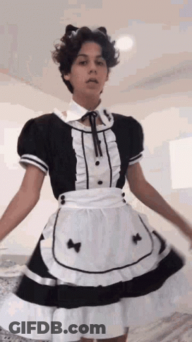 A Young Man Is Wearing A Maid Costume And A Cat Ear Headband . GIF