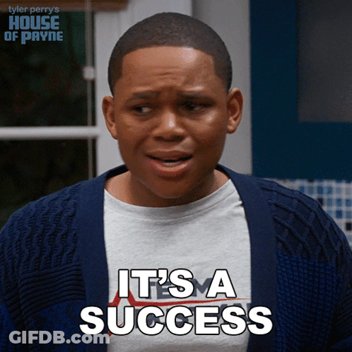 A Young Man Is Wearing A Sweater And A Shirt That Says " It 'S A Success " GIF
