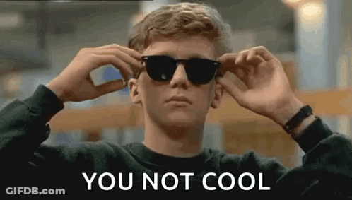 A Young Man Is Wearing Sunglasses And The Words `` You Not Cool '' Are Written On The Bottom . GIF