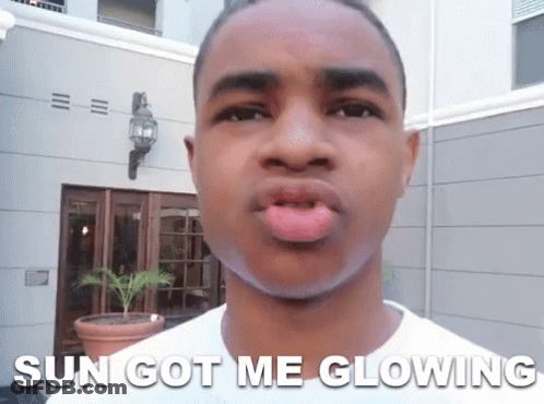 A Young Man Making A Funny Face With The Words Sun Got Me Glowing Below Him GIF