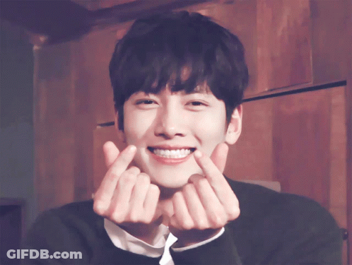 A Young Man Making A Heart With His Hands GIF