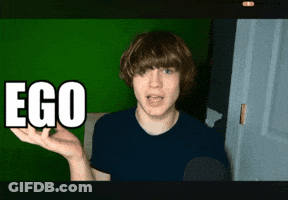 A Young Man Says Ego In Front Of A Green Wall GIF