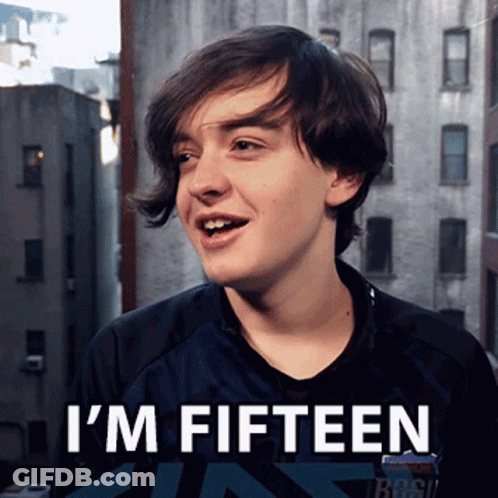 A Young Man Says I 'M Fifteen In Front Of Buildings GIF