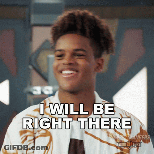A Young Man Says I Will Be Right There While Smiling GIF