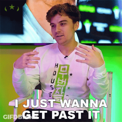 A Young Man Sitting In A Chair With The Words I Just Wanna Get Past It GIF