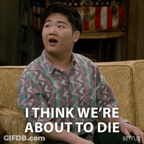 A Young Man Sitting On A Couch With The Words " I Think We 'Re About To Die " Below Him GIF