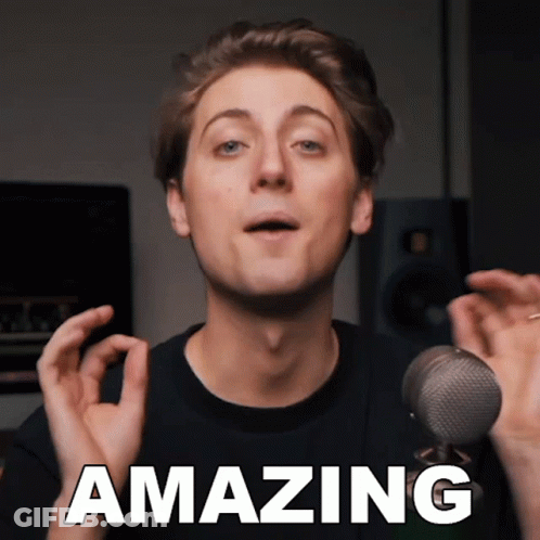 A Young Man Stands In Front Of A Microphone With The Words Amazing Above Him GIF