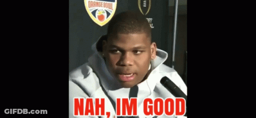 A Young Man Talking Into A Microphone With The Words " Nah Im Good " In Red Letters GIF