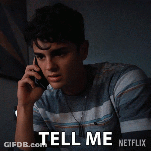 A Young Man Talking On A Cell Phone With The Words Tell Me Netflix Written Below Him GIF