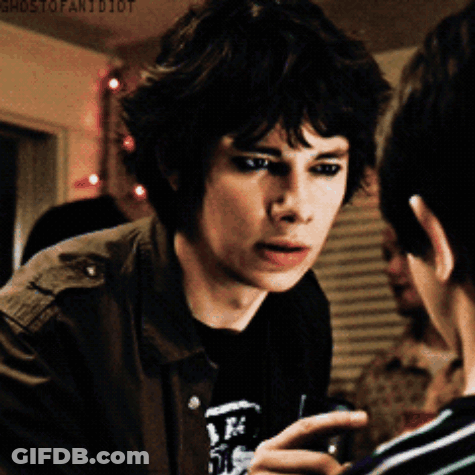 A Young Man Talking To Another Young Man With Ghostofanidiot Written On The Bottom Of The Image GIF