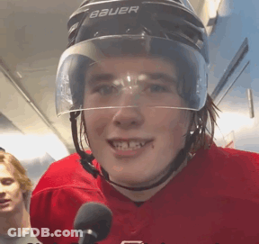 A Young Man Wearing A Bauer Helmet Is Smiling GIF