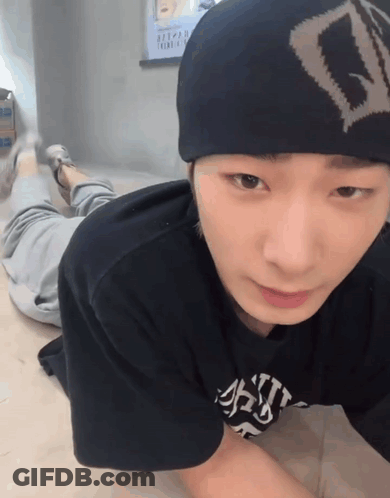 A Young Man Wearing A Beanie And A T-Shirt That Says ' A ' On It GIF