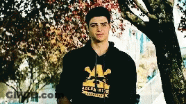 A Young Man Wearing A Black Adler High Hoodie GIF