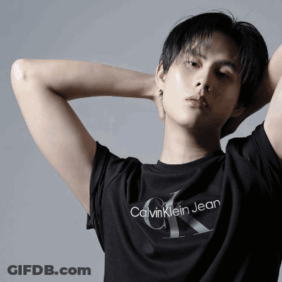 A Young Man Wearing A Black Calvin Klein Jean T-Shirt GIF