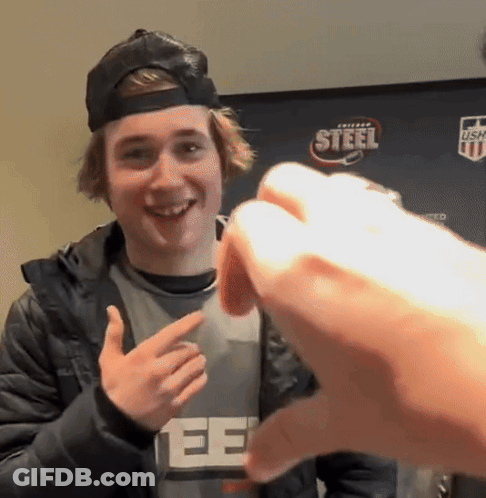 A Young Man Wearing A Black Hat And A Gray Shirt With The Word Steel On It GIF