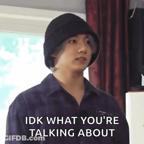 A Young Man Wearing A Black Hat Is Talking About Something . GIF