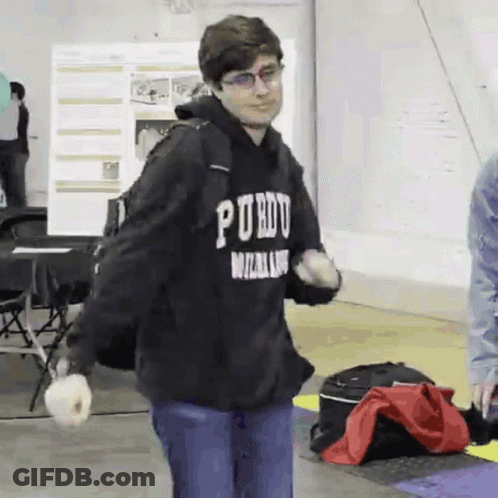 A Young Man Wearing A Black Hoodie That Says " Purdue " On It GIF