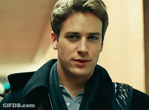 A Young Man Wearing A Black Jacket And A Grey Shirt GIF