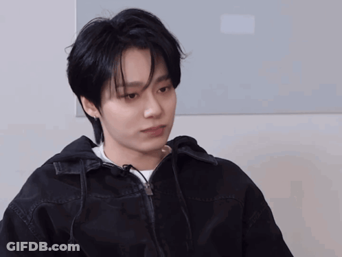 A Young Man Wearing A Black Jacket And White Shirt GIF
