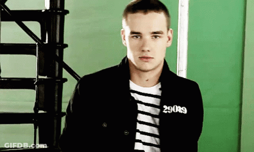 A Young Man Wearing A Black Jacket With The Number 29089 On His Chest GIF