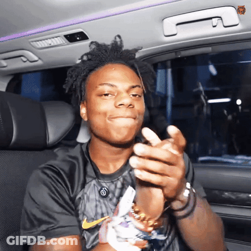 A Young Man Wearing A Black Nike Shirt Is Clapping His Hands GIF