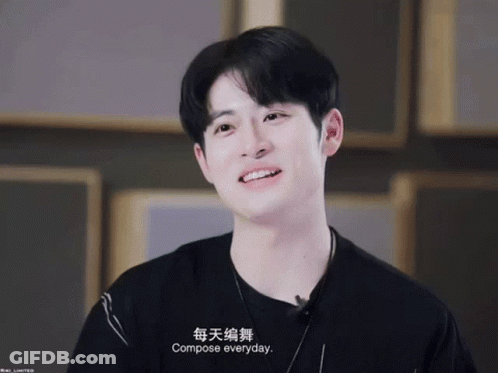 A Young Man Wearing A Black Shirt And A Necklace Says Compose Everyday GIF