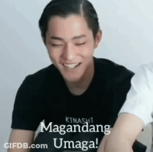 A Young Man Wearing A Black Shirt Is Smiling With His Eyes Closed And The Words `` Kinashi Magandang Umaga '' Written On GIF