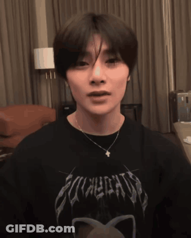 A Young Man Wearing A Black Shirt That Says Eclectic GIF