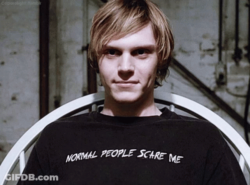 A Young Man Wearing A Black Shirt That Says Normal People Scare Me GIF