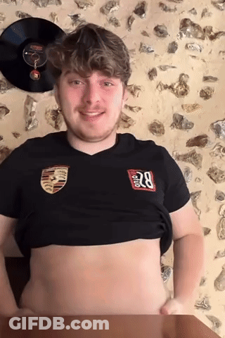 A Young Man Wearing A Black Shirt With The Number 28 On It GIF