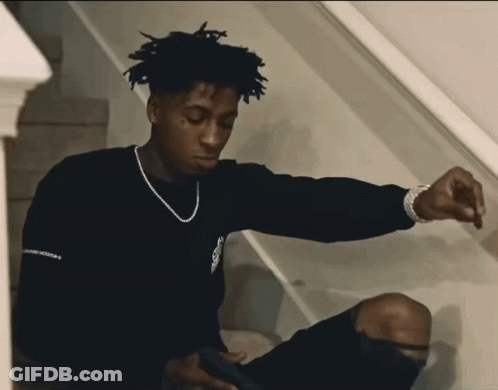 A Young Man Wearing A Black Sweater With The Word Freedom On It GIF