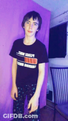 A Young Man Wearing A Black T-Shirt That Says ' Lte2e ' On It GIF