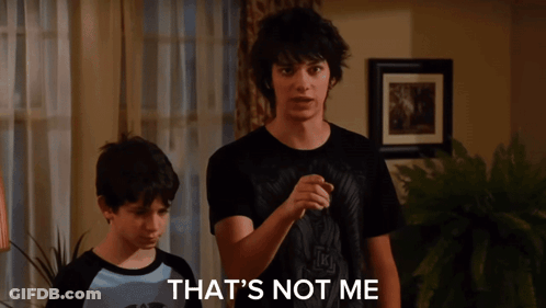 A Young Man Wearing A Black T-Shirt That Says ' Nirvana ' On It GIF