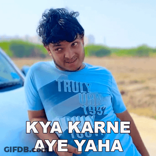 A Young Man Wearing A Blue Shirt That Says Truly Urn 1987 GIF