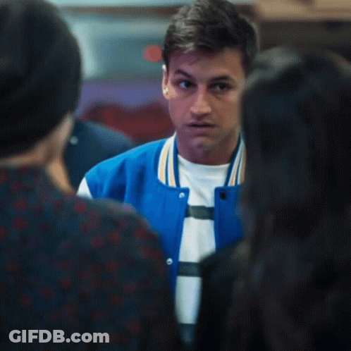 A Young Man Wearing A Blue Varsity Jacket With The Letter C On It GIF
