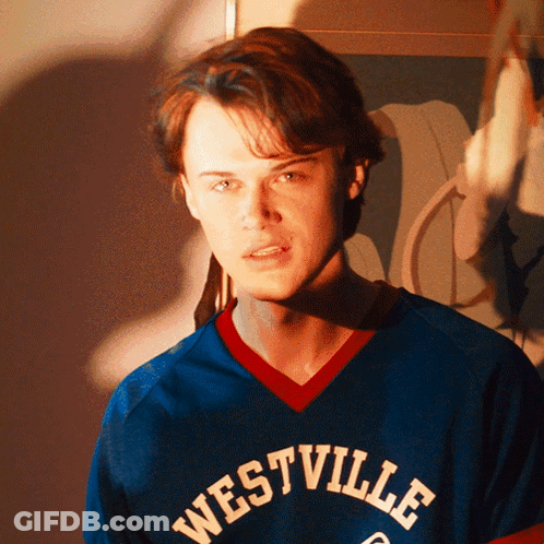 Young Man In Blue Westville Jersey Looking At Camera GIF
