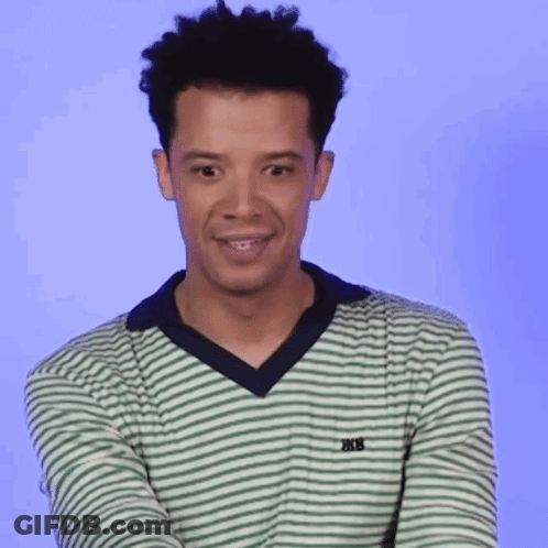 A Young Man Wearing A Green And White Striped Shirt With The Word Trek On The Front GIF