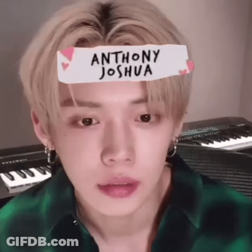 Young Man In Green Plaid Shirt With Joshua Sticker GIF