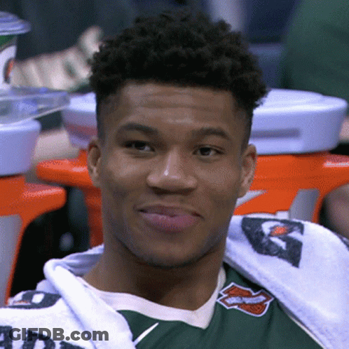 A Young Man Wearing A Green Shirt With The Word Harley Davidson On It Looks At The Camera GIF