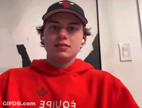 A Young Man Wearing A Hat And A Red Hoodie With The Word Eonibe On It GIF