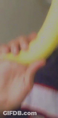 A Young Man Wearing A Hat Is Holding A Frisbee In His Hand And Blowing A Kiss . GIF
